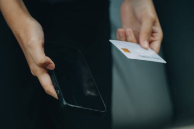 Close up of woman hand using credit card and laptop for payment and online shopping, Online shopping, payments digital banking, E-commerce concept.