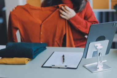 Startup SME small business entrepreneur of freelance Asian woman using a laptop with box Cheerful success Asian woman her hand lifts up online marketing packaging box and delivery SME idea concept