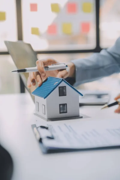 Real estate agent and customer signing contract to buy house, insurance or loan real estate.rent a house,get insurance or loan real estate or property.