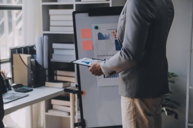 Close up of Business team analyzing income charts and graphs with modern laptop computer. Business analysis and strategy concept.