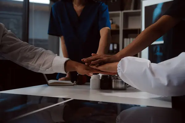 stock image Doctor handshake and partnership in healthcare, medicine or trust for collaboration, unity or support.Team of medical experts shaking hands in teamwork for or success in hospital