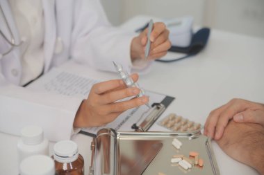 Healthcare service and pharmacy worker with customer at store counter for medication explanation. Pharmaceutical advice and opinion of pharmacist helping girl with medicine information.