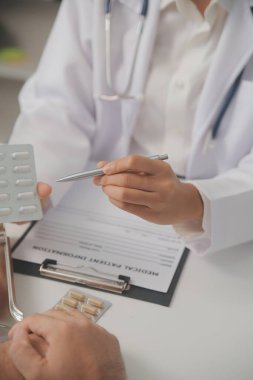 Healthcare service and pharmacy worker with customer at store counter for medication explanation. Pharmaceutical advice and opinion of pharmacist helping girl with medicine information.
