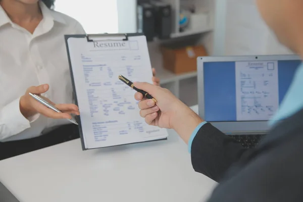 stock image Close up view of job interview in office, focus on resume writing tips, employer reviewing good cv of prepared skilled applicant, recruiter considering application, hr manager making hiring decision