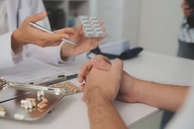 Healthcare service and pharmacy worker with customer at store counter for medication explanation. Pharmaceutical advice and opinion of pharmacist helping girl with medicine information.