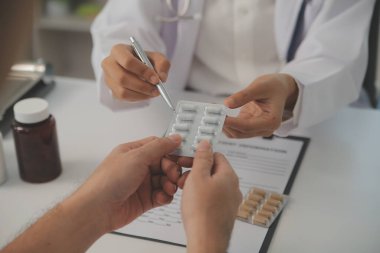Healthcare service and pharmacy worker with customer at store counter for medication explanation. Pharmaceutical advice and opinion of pharmacist helping girl with medicine information.