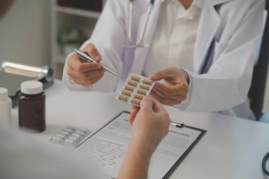 Healthcare service and pharmacy worker with customer at store counter for medication explanation. Pharmaceutical advice and opinion of pharmacist helping girl with medicine information.