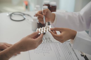Healthcare service and pharmacy worker with customer at store counter for medication explanation. Pharmaceutical advice and opinion of pharmacist helping girl with medicine information.