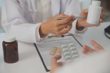 Healthcare service and pharmacy worker with customer at store counter for medication explanation. Pharmaceutical advice and opinion of pharmacist helping girl with medicine information.