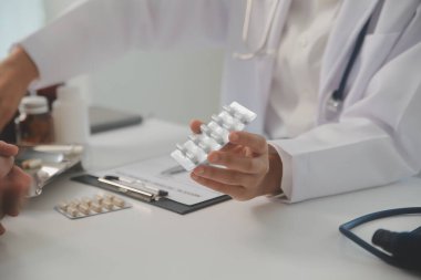 Healthcare service and pharmacy worker with customer at store counter for medication explanation. Pharmaceutical advice and opinion of pharmacist helping girl with medicine information.