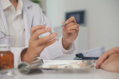 Healthcare service and pharmacy worker with customer at store counter for medication explanation. Pharmaceutical advice and opinion of pharmacist helping girl with medicine information.