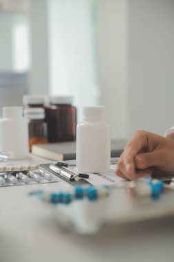 Healthcare service and pharmacy worker with customer at store counter for medication explanation. Pharmaceutical advice and opinion of pharmacist helping girl with medicine information.
