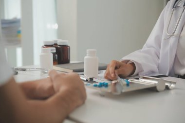 Healthcare service and pharmacy worker with customer at store counter for medication explanation. Pharmaceutical advice and opinion of pharmacist helping girl with medicine information.