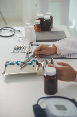 Healthcare service and pharmacy worker with customer at store counter for medication explanation. Pharmaceutical advice and opinion of pharmacist helping girl with medicine information.
