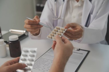 Healthcare service and pharmacy worker with customer at store counter for medication explanation. Pharmaceutical advice and opinion of pharmacist helping girl with medicine information.