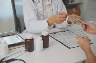 Healthcare service and pharmacy worker with customer at store counter for medication explanation. Pharmaceutical advice and opinion of pharmacist helping girl with medicine information.