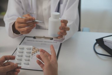 Healthcare service and pharmacy worker with customer at store counter for medication explanation. Pharmaceutical advice and opinion of pharmacist helping girl with medicine information.