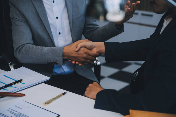 Consultation and conference of Male lawyers and professional businesswoman working and discussion having at law firm in office. Concepts of law, Judge gavel with scales of justice.