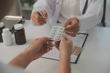 Healthcare service and pharmacy worker with customer at store counter for medication explanation. Pharmaceutical advice and opinion of pharmacist helping girl with medicine information.