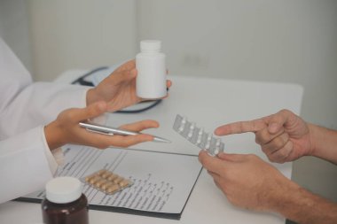 Healthcare service and pharmacy worker with customer at store counter for medication explanation. Pharmaceutical advice and opinion of pharmacist helping girl with medicine information.