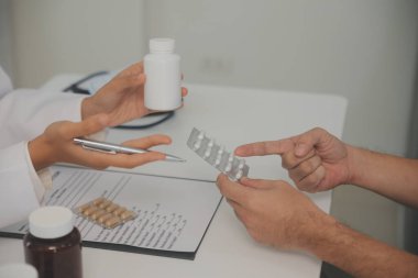 Healthcare service and pharmacy worker with customer at store counter for medication explanation. Pharmaceutical advice and opinion of pharmacist helping girl with medicine information.