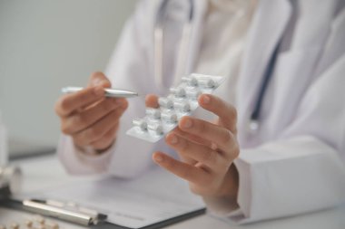 Healthcare service and pharmacy worker with customer at store counter for medication explanation. Pharmaceutical advice and opinion of pharmacist helping girl with medicine information.