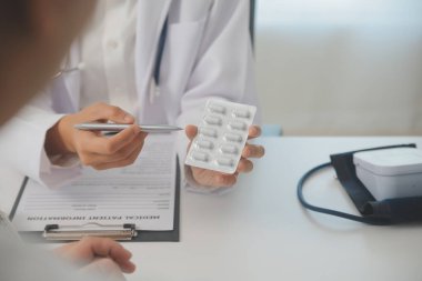 Healthcare service and pharmacy worker with customer at store counter for medication explanation. Pharmaceutical advice and opinion of pharmacist helping girl with medicine information.