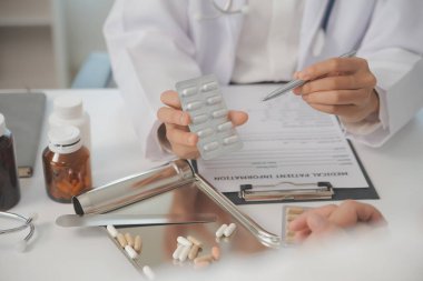 Healthcare service and pharmacy worker with customer at store counter for medication explanation. Pharmaceutical advice and opinion of pharmacist helping girl with medicine information.