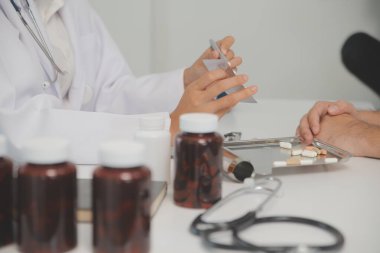 Healthcare service and pharmacy worker with customer at store counter for medication explanation. Pharmaceutical advice and opinion of pharmacist helping girl with medicine information.