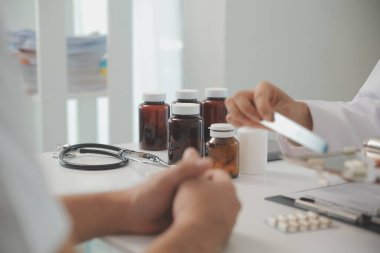 Healthcare service and pharmacy worker with customer at store counter for medication explanation. Pharmaceutical advice and opinion of pharmacist helping girl with medicine information.