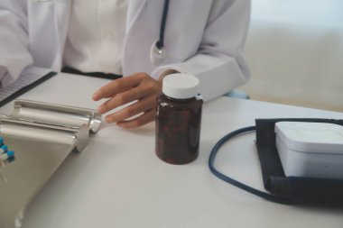 Healthcare service and pharmacy worker with customer at store counter for medication explanation. Pharmaceutical advice and opinion of pharmacist helping girl with medicine information.