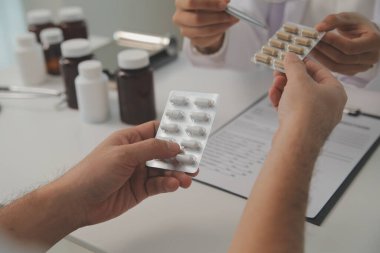 Healthcare service and pharmacy worker with customer at store counter for medication explanation. Pharmaceutical advice and opinion of pharmacist helping girl with medicine information.