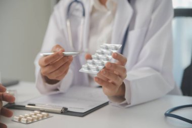 Healthcare service and pharmacy worker with customer at store counter for medication explanation. Pharmaceutical advice and opinion of pharmacist helping girl with medicine information.