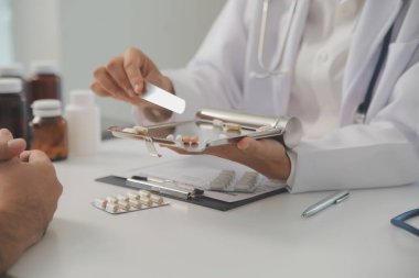 Healthcare service and pharmacy worker with customer at store counter for medication explanation. Pharmaceutical advice and opinion of pharmacist helping girl with medicine information.