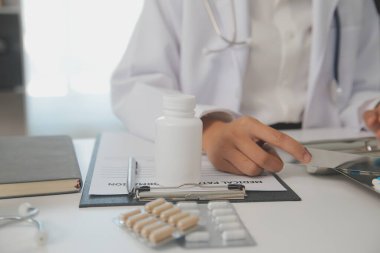 Healthcare service and pharmacy worker with customer at store counter for medication explanation. Pharmaceutical advice and opinion of pharmacist helping girl with medicine information.