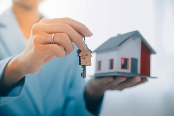 Real estate agent talked about the terms of the home purchase agreement and asked the customer to sign the documents to make the contract legally, Home sales and home insurance concept.