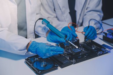 Close up of Technician measuring voltage electronic circuit board television, Service after sale fix electric equipment within insurance.