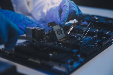 Close up of Technician measuring voltage electronic circuit board television, Service after sale fix electric equipment within insurance.