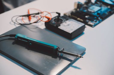 Close up of Technician measuring voltage electronic circuit board television, Service after sale fix electric equipment within insurance.