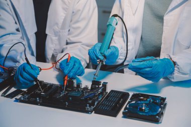 Close up of Technician measuring voltage electronic circuit board television, Service after sale fix electric equipment within insurance.