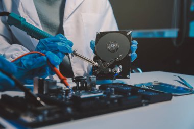 Close up of Technician measuring voltage electronic circuit board television, Service after sale fix electric equipment within insurance.