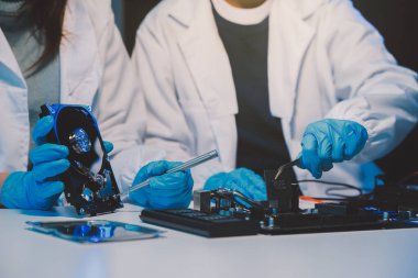Close up of Technician measuring voltage electronic circuit board television, Service after sale fix electric equipment within insurance.