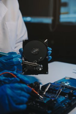 Close up of Technician measuring voltage electronic circuit board television, Service after sale fix electric equipment within insurance.