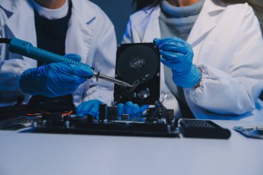 Close up of Technician measuring voltage electronic circuit board television, Service after sale fix electric equipment within insurance.