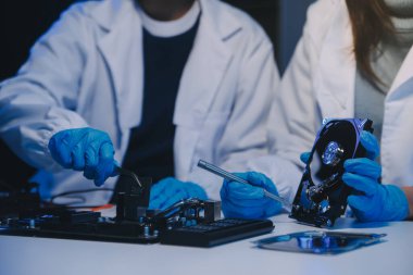Close up of Technician measuring voltage electronic circuit board television, Service after sale fix electric equipment within insurance.