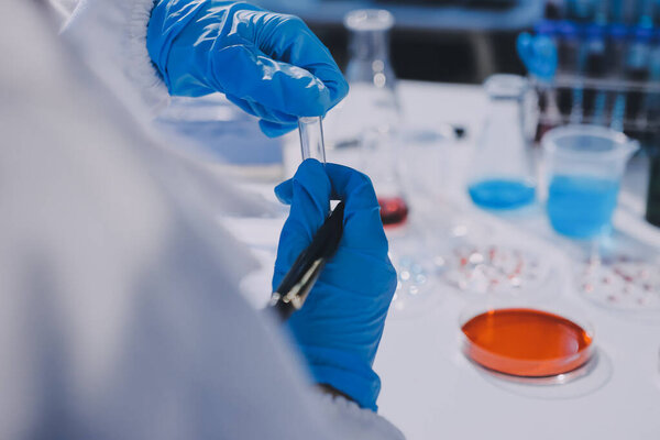 Researcher using a professional microscope