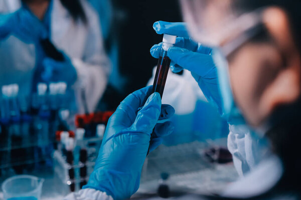 Researcher using a professional microscope