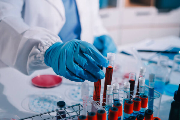 Researcher using a professional microscope