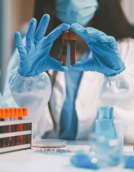 Research, experiment and medical trial being done by a scientist in a lab, science facility or hospital. One young, serious and professional researcher organizing, sorting or making a discovery