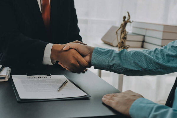 Lawyer explained to the client about the law that must be brought against the court case.